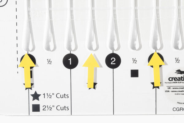 Stripology XL cutting slits with arrows pointing to the 1-1/2 and 2-1/2 inch cuts